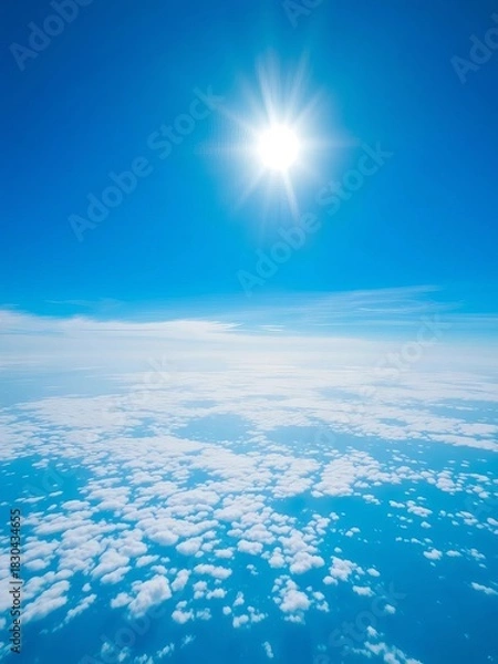 Obraz Vibrant blue expanse with soft, scattered white clouds under a brilliant sun,  bright sky,  serene