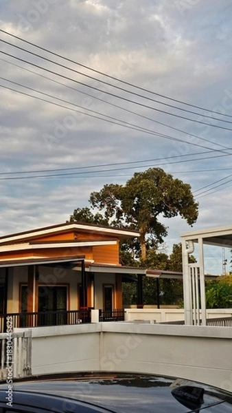 Obraz Modern city street at night, with building architecture and the dark sky above