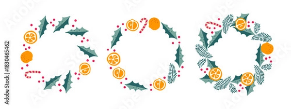 Fototapeta Festive wreath set. Vibrant New Year's designs with oranges, mandarins, mistletoe branches, candy canes for holiday cards, decorations.Three Christmas wreath designs. Round frame set with copy space.