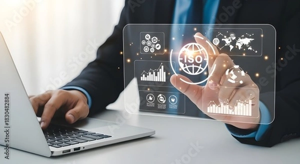 Obraz Businessman interacting with futuristic digital interface and laptop for data analysis