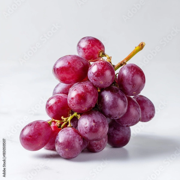 Obraz AI-generated image - A fresh bunch of ripe, red grapes with several loose berries, isolated on a clean white background.