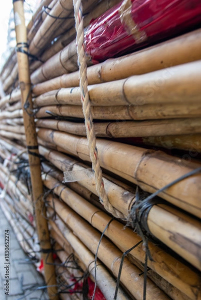 Obraz A stack of bamboo sticks in a market