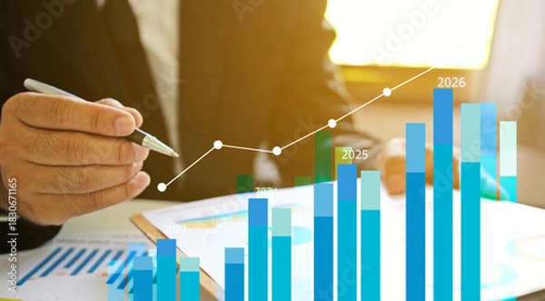 Fototapeta Businessman reviewing balance sheet and virtual data charts. financial analysis concept, strategy planning and growth opportunities, calculating company investment