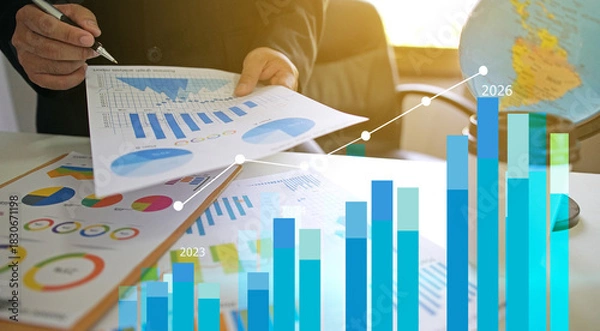 Fototapeta Businessman reviewing balance sheet and virtual data charts. financial analysis concept, strategy planning and growth opportunities, calculating company investment