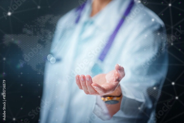 Obraz Doctor with stethoscope pointing toward virtual medical space. Concept of healthcare, diagnostics, telemedicine and modern medical technology.