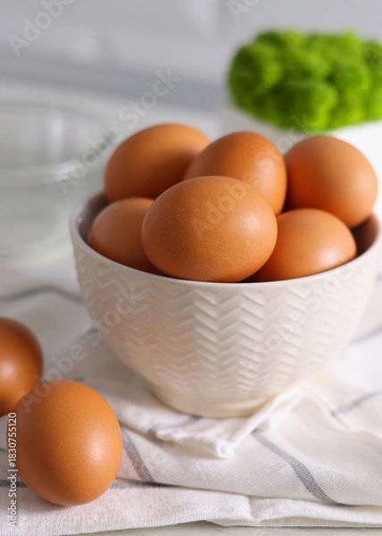 Fototapeta fresh farm chicken eggs on a colored background. Vertical photo format