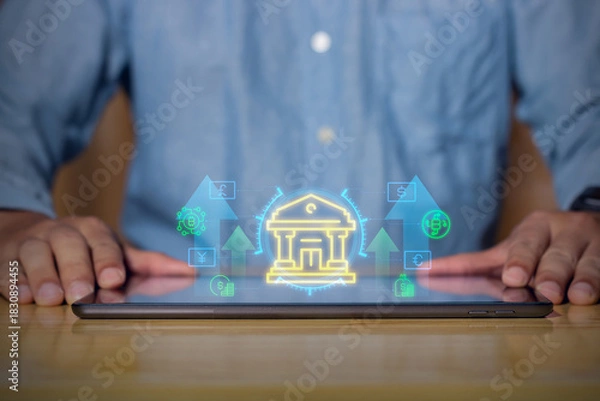 Fototapeta Digital banking innovation showing glowing fintech icons and money transfer symbols on a tablet, representing modern financial services and online transactions.