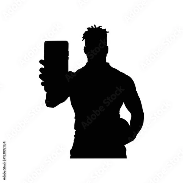 Obraz Silhouette of a muscular man holding a tablet device for communication