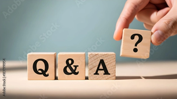 Fototapeta Hand placing a question mark block next to q and a blocks