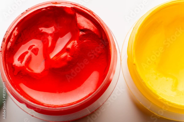 Obraz jar of bright red paint, macro shot of the texture. Paint on a white table, a drawing and art tool