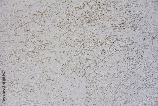Fototapeta a close-up of a scratched wall texture. The texture resembles grooves and ridges, for web design, social media, backgrounds