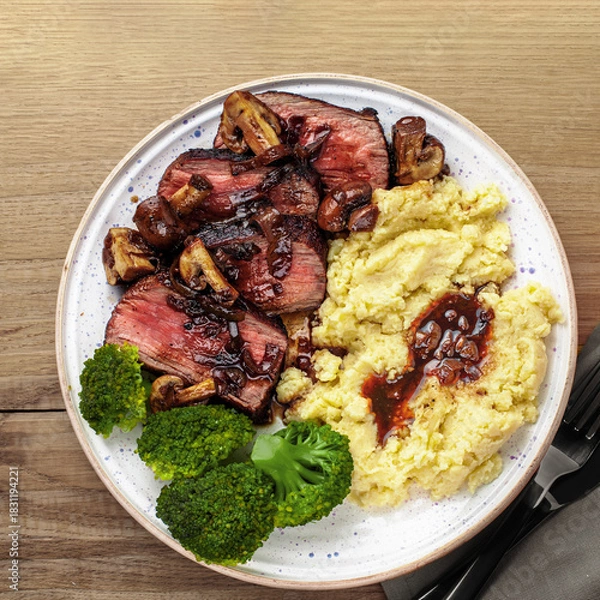 Obraz Sliced Medium Rare Steak with Mashed Potatoes and Broccoli