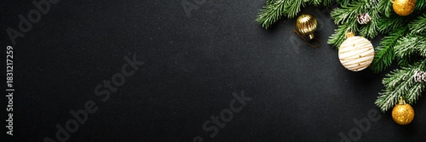 Obraz Christmas decorations and spruce tree at black background.