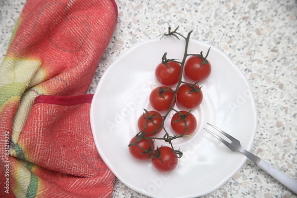 Fototapeta cherry tomatoes on a plate