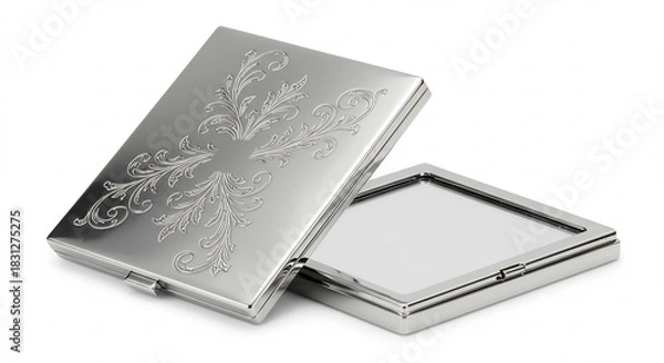 Fototapeta 白い背景にきらめく銀色の高級感あふれる金属製小物入れ 蓋に施された繊細な唐草模様の彫刻が柔らかい光を美しく反射 半開きの状態から内部の光沢も覗かせ全体が上品に輝く. AI Generated