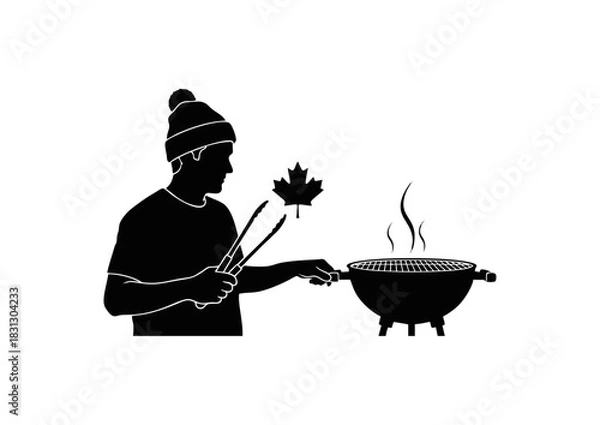 Fototapeta Silhouette of a person in a beanie grilling a maple leaf on a barbecue