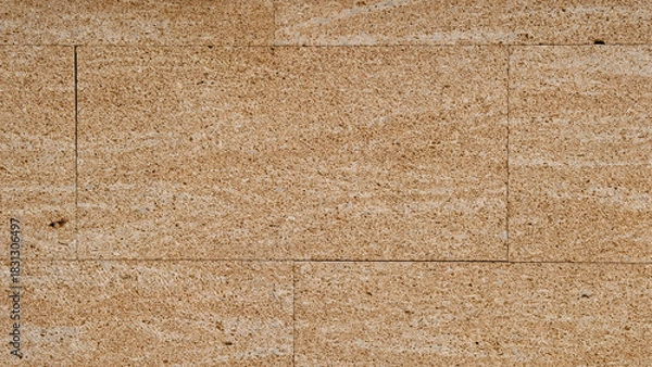 Obraz Wall texture background with fossiliferous yellow peach pink orange sandstone slabs cladding. Interior and exterior decoration with rustic mediterranean style textured stone and rock tiles. 