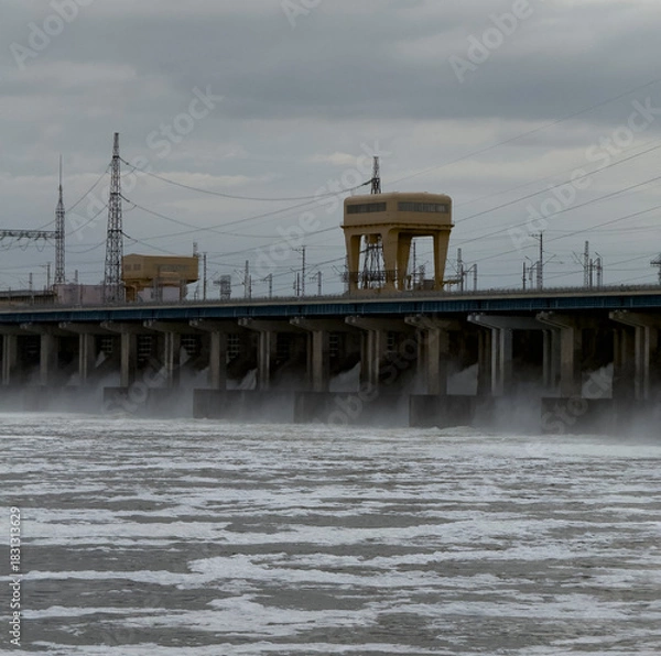 Obraz Water rushes under the bridge as mist rises, capturing the cool atmosphere of the scene