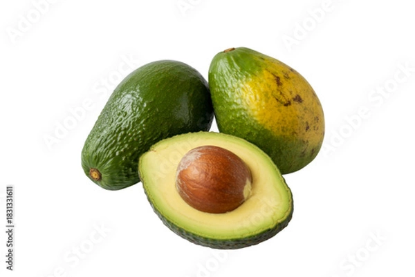 Fototapeta Two whole avocados and one half avocado with pit on black background fruit food