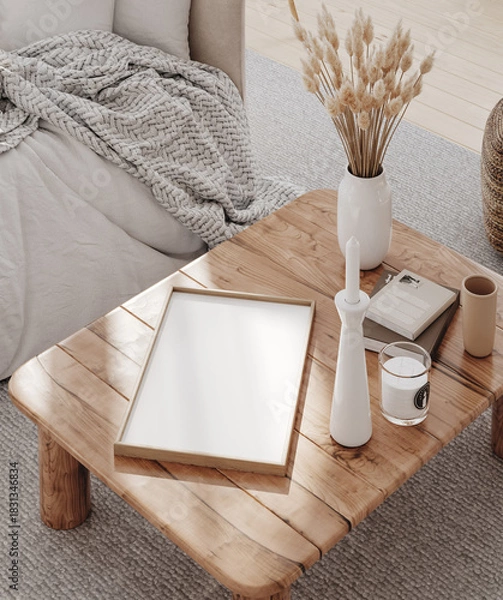 Fototapeta Wooden frame mockup close up in living room laying on the coffee table with decor, 3d render