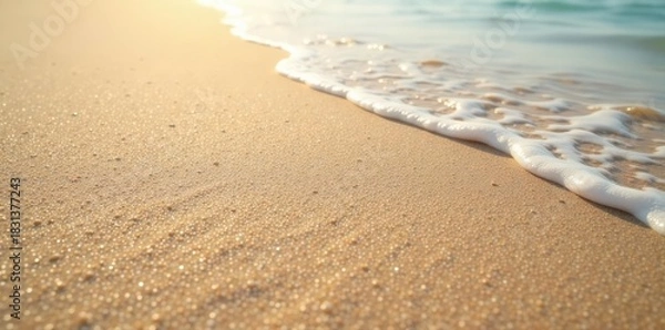 Fototapeta Textured sand with gentle sea ripples close-up, wave pattern, texture, grain