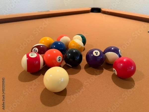 Obraz Billiards Table 9-Ball Game: Pool table with beige felt cloth featuring multiple balls arranged for a game.