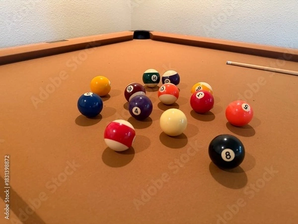 Obraz Billiards Table 9-Ball Game: Pool table with beige felt cloth featuring multiple balls arranged for a game.