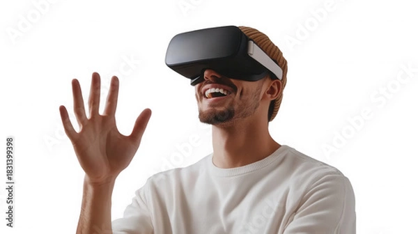 Fototapeta A man wearing a vr headset with his hand raised and a happy expression on a black isolated background on transparent background