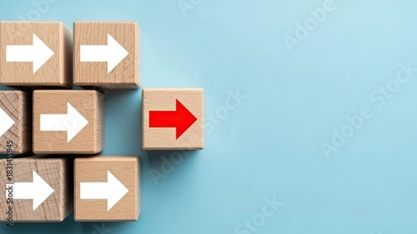 Obraz Red arrow block stands out among white arrows, showing unique direction