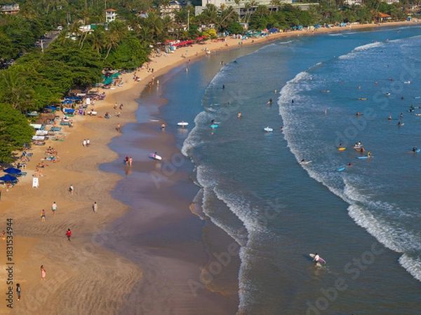 Fototapeta Aerial view of Weligama Beach with surfers riding the waves, Sri Lanka