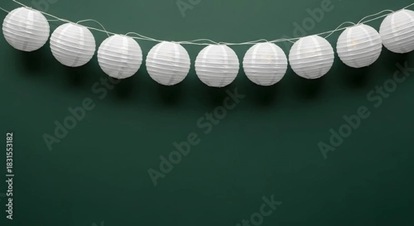 Fototapeta White string lights garland decoration on dark green background with copy space