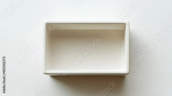 Fototapeta A plain, white rectangular box is shown from above.
