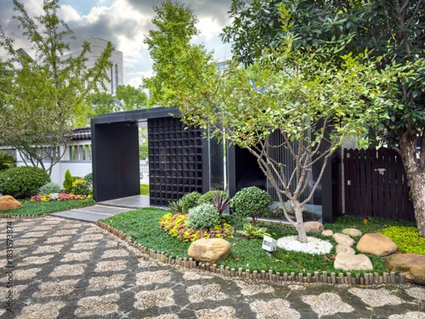 Obraz Tranquil Escape: A Modern Garden Oasis Featuring Lush Greenery and Stylish Design