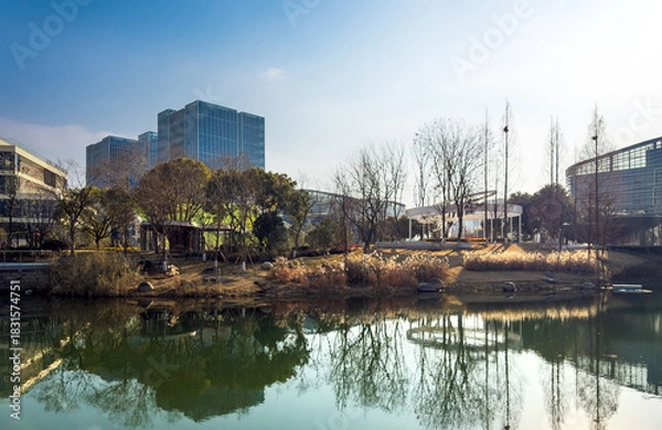 Obraz Captivating Urban Reflections Under a Clear Blue Sky
