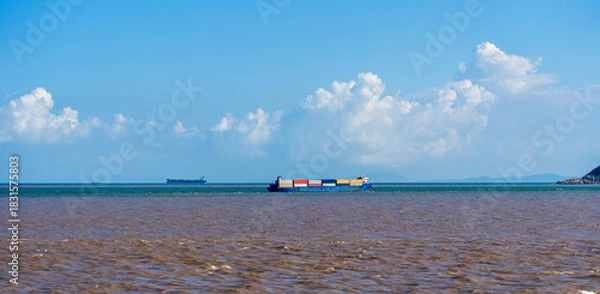 Obraz Tranquil Seascape with Container Ships on Calm Waters Under a Scenic Sky