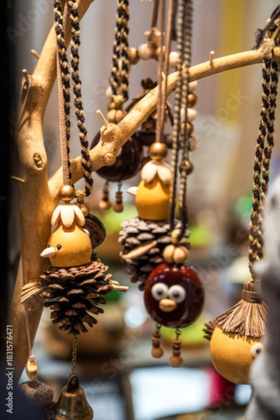 Obraz Charming Handmade Decorative Ornaments Hanging from a Rustic Display Tree