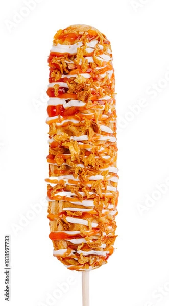 Fototapeta Delicious corn dog topped with crunchy toppings and drizzle