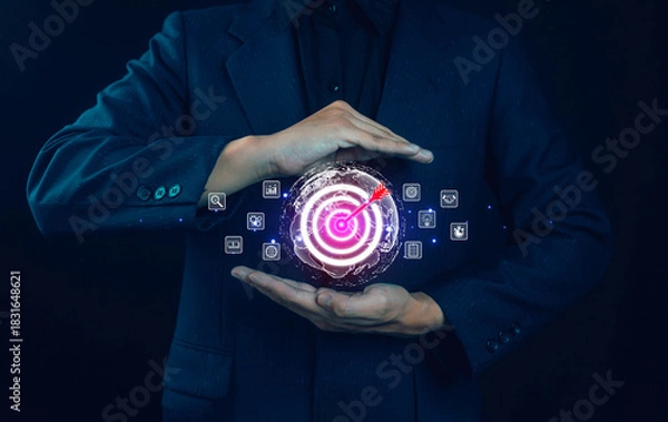 Fototapeta Business goal setting concept. Businessman holding virtual target icon for business purpose. Strategic planning for business growth. Marketing strategy and goal for success.