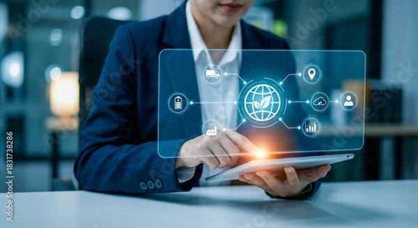 Obraz Business professional interacting with a futuristic holographic interface displaying digital data and icons