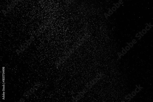 Obraz The falling white snow on a black background