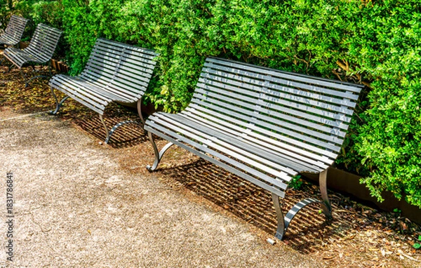 Fototapeta beautiful bench in a green park for relavation with amazing view to a pamorama above