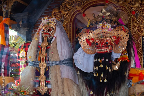 Fototapeta Two sacred masks of Rangda and Barong at Hindu temple. Mythological demon queen and lion spirit. Symbol of good and evil balance in Balinese culture.
