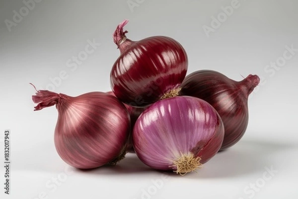 Fototapeta Fresh red onions piled together isolated on white background