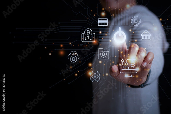 Fototapeta A hand activating digital cryptocurrency and fintech icons on a futuristic interface, symbolizing blockchain, finance, and modern digital transactions.
