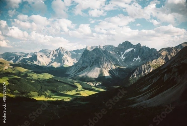 Fototapeta  Majestic Mountain Panorama: Breathtaking mountain vista unfolds, as dramatic peaks pierce the sky, creating a scene of unparalleled natural beauty. The composition captures the raw power of nature.