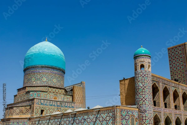 Fototapeta Uzbekistan architecture in Samarkand and Bukhara with intricate mosaics blue domes ancient madrasas Islamic patterns historic monuments vibrant tilework and cultural heritage in bright daylight