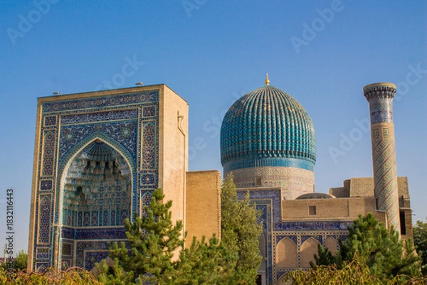Fototapeta Uzbekistan architecture in Samarkand and Bukhara with intricate mosaics blue domes ancient madrasas Islamic patterns historic monuments vibrant tilework and cultural heritage in bright daylight