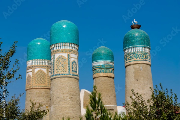 Fototapeta Uzbekistan architecture in Samarkand and Bukhara with intricate mosaics blue domes ancient madrasas Islamic patterns historic monuments vibrant tilework and cultural heritage in bright daylight