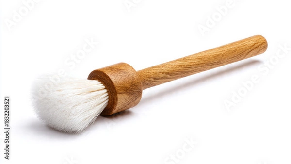 Fototapeta A clean, natural wooden handle brush with soft white bristles, photographed against a crisp white background. Ideal for kitchen basting, pastry, or dusting.