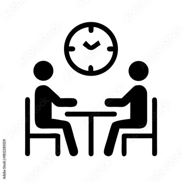 Fototapeta Two people sitting at a table with a clock on the wall representing a scheduled meeting time frame
